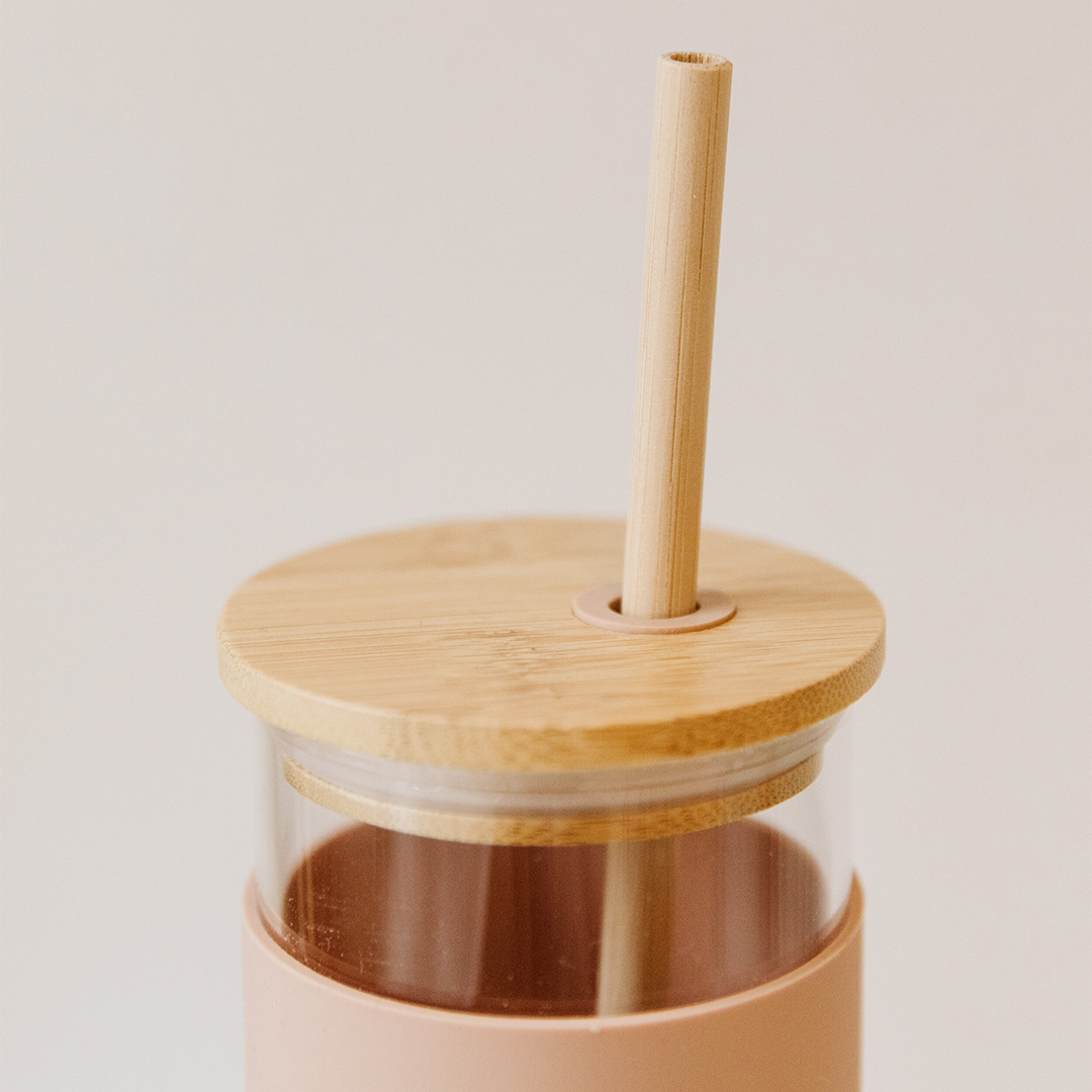 glass bottle with lid and straw